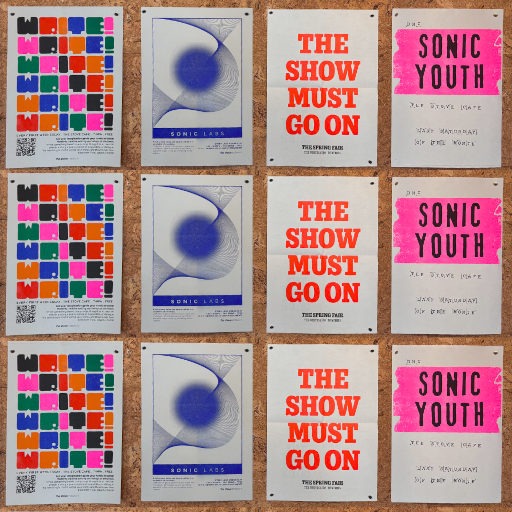A 4×4 grid of posters pinned to a corkboard, featuring four distinct designs repeated in columns. The first design shows a colourful grid of squares with the word “WRITE” repeated in varying colours and orientations, with a QR code in the bottom left. The second has a blue and white abstract geometric pattern with the text “SONIC LABS” and smaller, partially legible descriptive text. The third features bold red text on a beige background reading “THE SHOW MUST GO ON” with the same phrase repeated in smaller text below. The fourth has a pink background with handwritten‑style text reading “SONIC YOUTH”